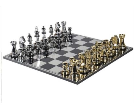 CHESS SET, with oversized gilt and silvered pieces, the board 60cm square. 