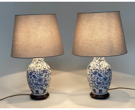 TABLE LAMPS, 75cm H, a pair, Chinese blue and white ceramic of vase form with circular wood bases and shades. (2) 