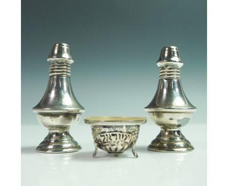 This 3-piece silver set includes a pair of salt and pepper shakers along with a footed salt cellar. The shakers feature a cla