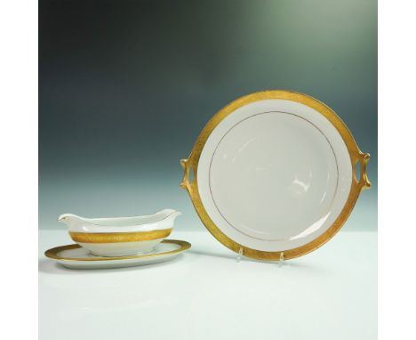 Made in Bavaria by Hutschenreuther Selb, this elegant 2-piece porcelain set features a double-sided gravy boat paired with a 