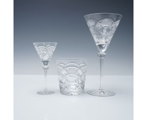 A finely crafted set of three crystal drinking glasses by Cristal Donau featuring two stemware glasses and one tumbler. Each 