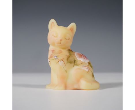 This Fenton Burmese glass cat figurine showcases a soft satin finish with a delicate pink-to-yellow gradient, a signature cha