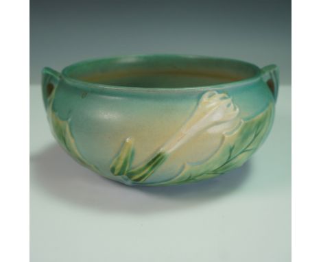 A vintage Roseville Pottery Thornapple bowl in the sought-after blue glaze. This elegant piece features a round form with scu