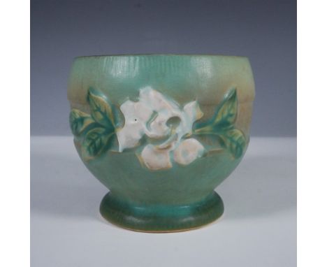 A beautiful Roseville Pottery Magnolia jardiniere, model 657-3, produced circa 1943. This piece showcases the Magnolia patter