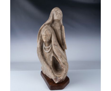 Hand carved marble sculpture featuring two Native American figures, with one man positioned overhead of the other, symbolizin