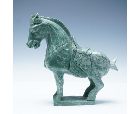 A finely hand-carved marble sculpture depicting a horse in the Tang Dynasty style, characterized by its muscular form, detail