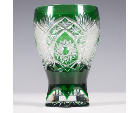 A stunning Bohemian cut-to-clear crystal vase in deep emerald green, featuring masterfully hand-cut geometric and floral patt