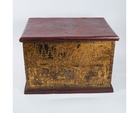 This striking Thai chest features elaborate gilded relief panels depicting traditional temple scenes and ceremonial processio