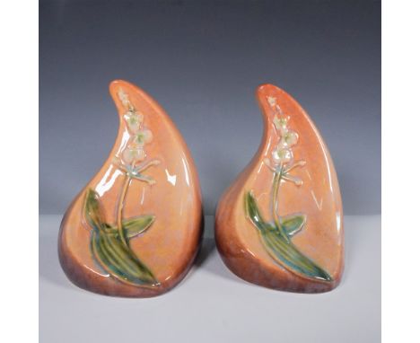 These elegant bookends from Roseville Pottery are part of the Wincraft line, shape #259, finished in a rich mottled vermillio