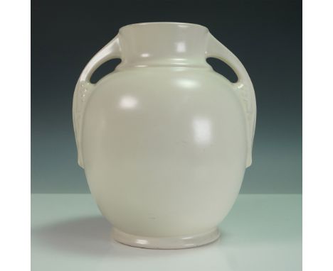 A classic Roseville Pottery vase in an elegant ivory glaze, featuring an Art Deco-influenced form with symmetrical double han