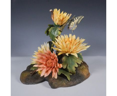 A finely crafted limited edition Boehm porcelain sculpture depicting a chrysanthemum in full bloom, accompanied by a delicate