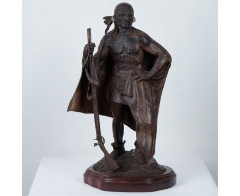 A striking bronze sculpture of the King of the Maqua (Mohawk) signed by the artist Jud Hartmann. The figure is depicted stand