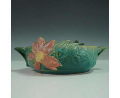 A classic Roseville Pottery Clematis handled bowl in a rich green glaze with a raised floral motif. This design features a la