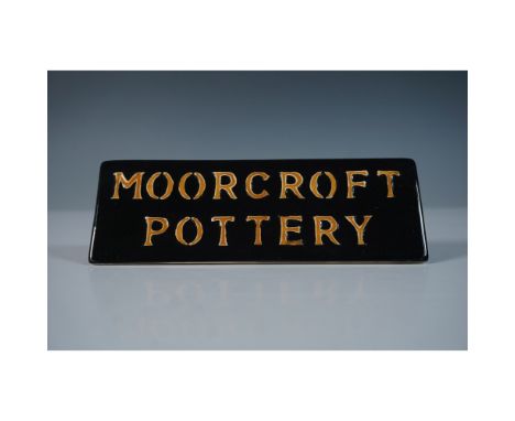 Designed by Emma Bossons. This Moorcroft pottery table display plaque features a striking dual-sided design. One side present