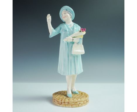 The figurine of HM Queen Elizabeth The Queen Mother is made of fine bone china and portrays her in a formal ensemble. She is 