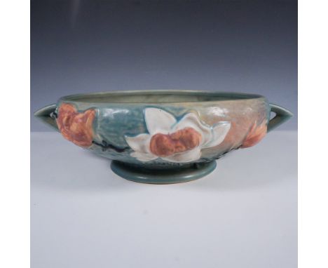 This striking console bowl from Roseville Pottery features the Magnolia pattern, showcasing high-relief blossoms in shades of