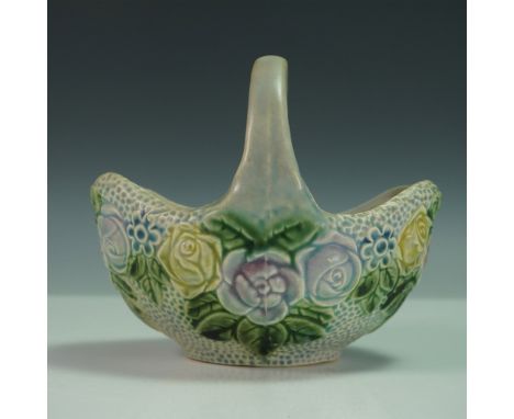 Vintage Roseville pottery basket in the Rozane pattern, featuring a raised floral design in a soft pastel color palette of la