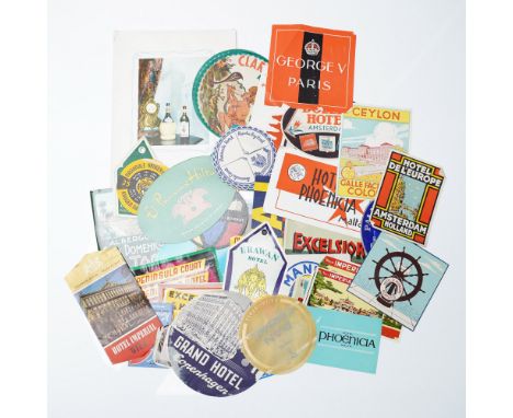 A captivating collection of approximately 42 vintage travel ephemera pieces, primarily unused hotel luggage stickers from ico