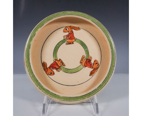 A charming Roseville Pottery Juvenile Ware plate featuring the whimsical "Rabbits" design. This early 20th-century piece show