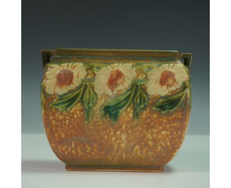 This vintage Roseville Pottery vase features the Dahlrose pattern, known for its soft, sculpted florals and speckled glaze. F