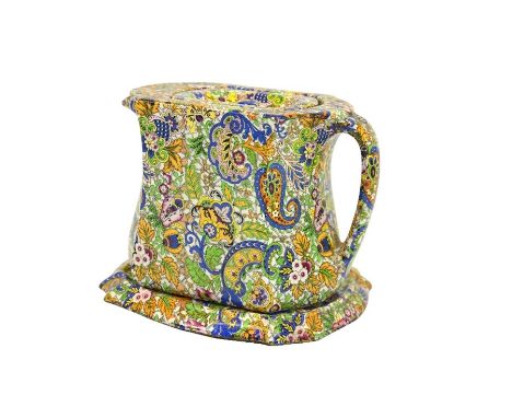A Wade paisley chintz Compacto teapot and stand, circa 1924, transfer printed with geometric and foliate pattern throughout, 