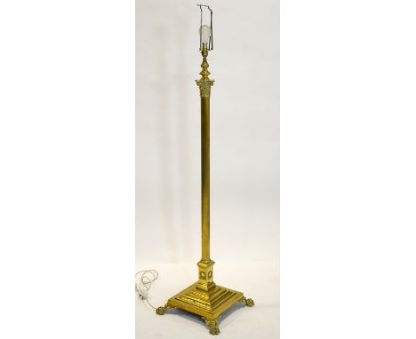 An Edwardian brass standard lamp, circa 1905, Corinthian column form, on wreath pedestal and stepped square base with lions p
