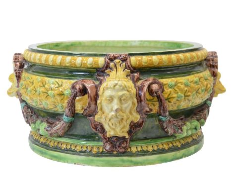 Lizzie Wilkins for Della Robbia, an art pottery majolica champagne cooler, relief moulded with shells, masks and apple garlan