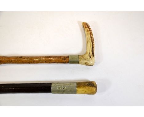 An antler handled stick, 85.5cm long,  together with a military swagger stick, with bone pommel stamped RS and E. Goddard 194