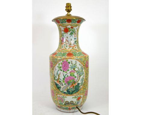 A Chinese famille rose vase, converted to a lamp base, Qianlong style, 19th century, yellow foliate scroll ground with four s