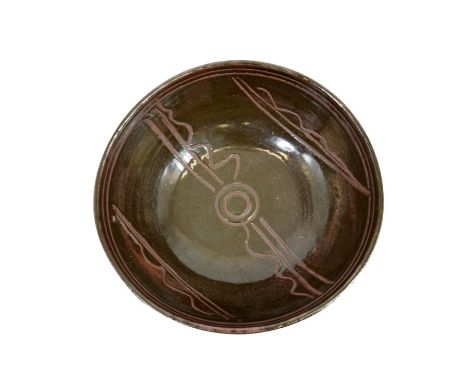 Michael Cardew for Wenford Bridge, a large studio pottery bowl, tenmoku glazed with incised circle and line decoration, impre