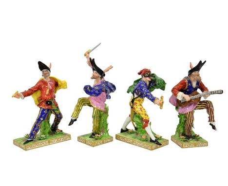 Samson, Paris, after Derby, a porcelain commedia dell'arte troop of four figures, modelled in animated poses, one playing a g