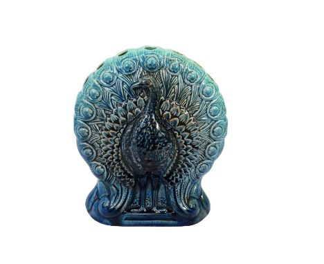 Christopher Dresser for Ault, a stem vase in the form of a peacock, blue glaze, stamped factory mark impressed 358, 19cm high