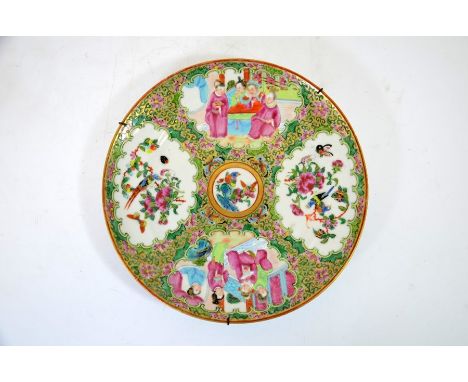 A Chinese Canton famille rose plate, probably Qianlong, 18th century, four panels of alternating figures and birds in foliate