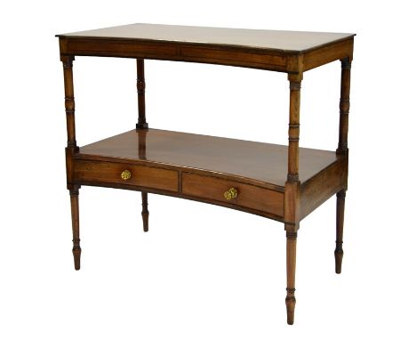 A George IV mahogany two tier side table, circa 1820, concave fronted and ebony strung with two drawers to the lower shelf, s