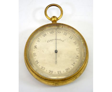 A gilt brass military issue pocket barometer, compensated, B1246, crows foot mark, 7cm diameter