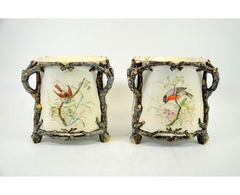 A pair of Royal Worcester jardinieres, 1868, painted with birds probably by John Hopewell, within relief moulded and enamelle