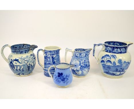 A collection of Staffordshire blue and white transfer printed jugs, including pearlware, Copeland Spode, Semi China, Nuneham 