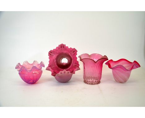 A collection of cranberry glass light shades, including opalescent, optic moulded, pair of crimped opaque shades, 3cm fixing 