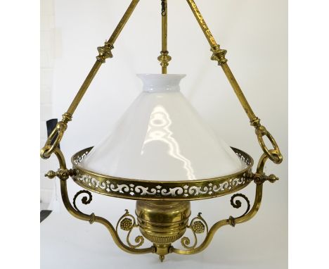 A large Aesthetic Movement brass pendant light fitting, the reticulated ring supported on three square section rod and ring a