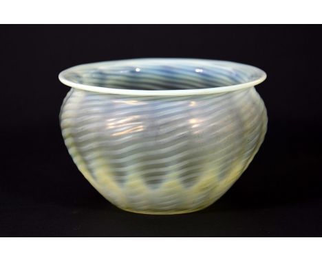 John Walsh Walsh for W A S Benson, an Arts and Crafts glass light shade, optic moulded straw opal with ribbed wrythen detaili