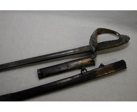 British Victorian Naval Officers dress sword with 29 inch slightly curved single fullered blade with elaborate engrave scroll