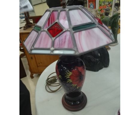 A Moorcroft lamp base and Tiffany-style shade one base decorated with pearls on a blue ground