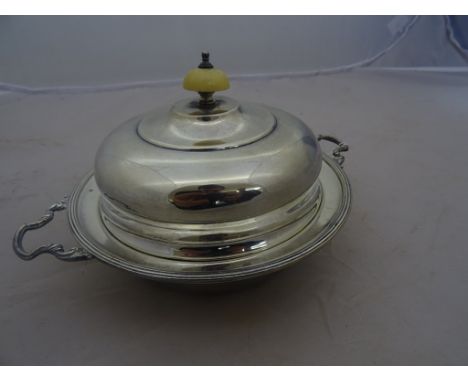 A silver muffin dish and cover, by Brook & Sons, Sheffield (1923) of conventional form: cover with an ivory button.