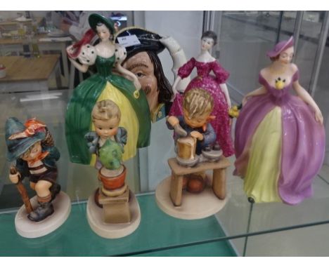 A collection of figurines comprising two crinoline figures by Goebel, a lady weaving magenta dress by Royal Worcester, a Roya