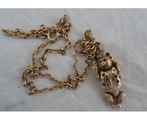 A 9ct articulated bear pendant on a 9ct Cartier-style chain