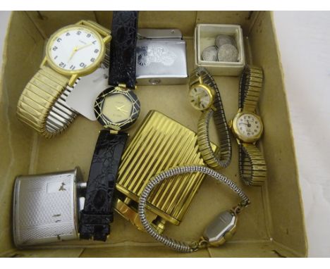 A mixed lot of items comprising two lighters, a musical lighter, five wristwatches and 11 silver coins