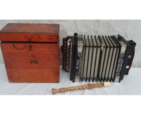 A boxed "The Peerless Accordion"; together with a Schotts "C" recorder