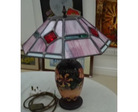 A Moorcroft lamp base and Tiffany-style shade, one base decorated with honeysuckle and dog rose flowers