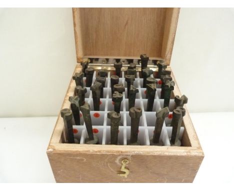 Book Binding Equipment. &nbsp;Wooden box containing 31 book binder's gold finishing hand tools, comprising incomplete alphabe