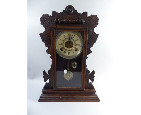 An American Gingerbread Mantle Clock with Eight Day Movement Chiming on Gong and Bell, 54cm High 